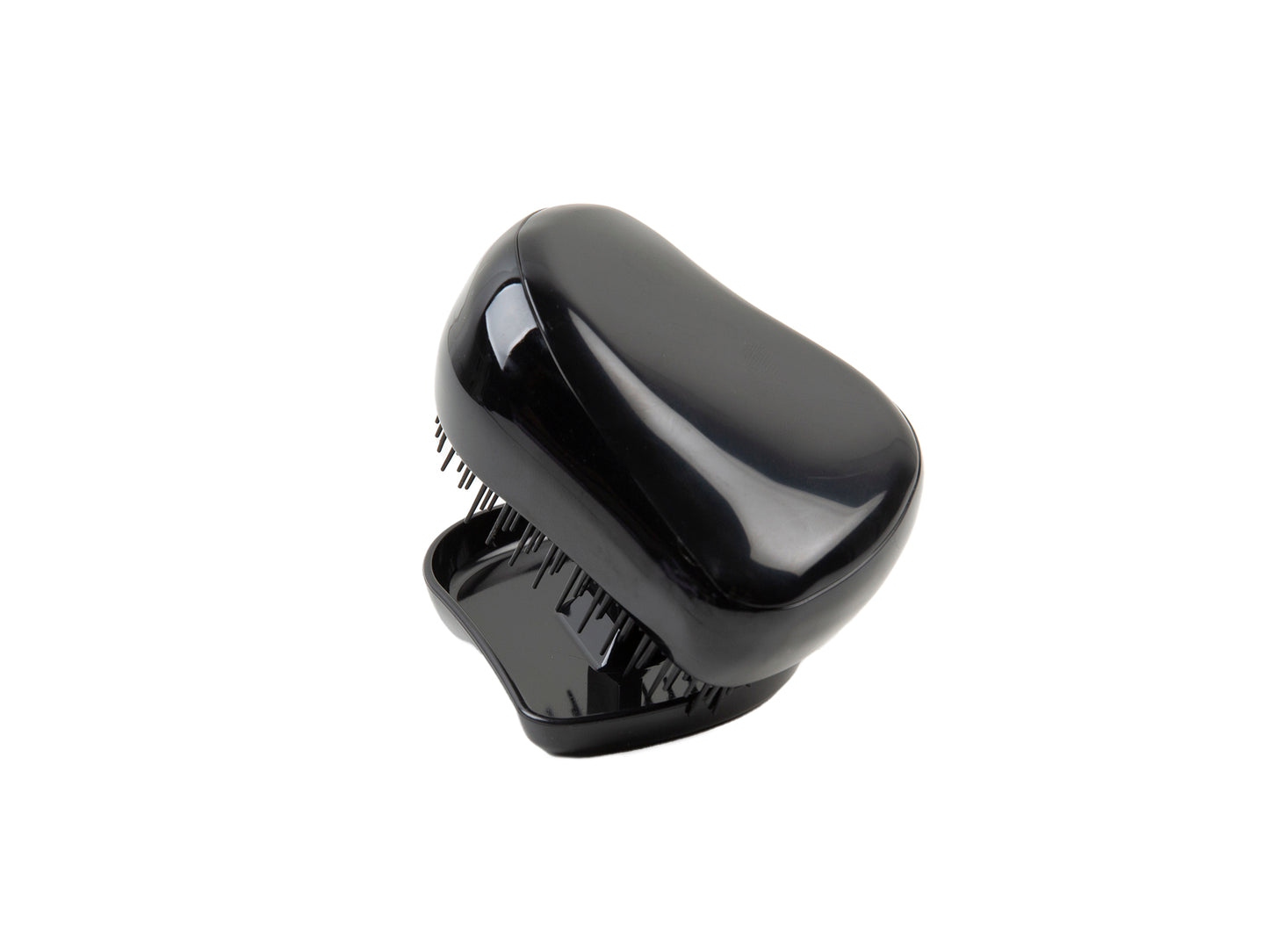 Compact black detangling brush. Travel.